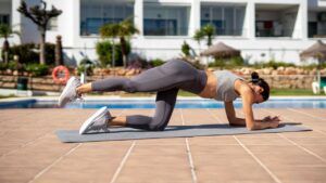 Woman,Is,Performing,A,Fitness,Exercise,On,A,Yoga,Mat