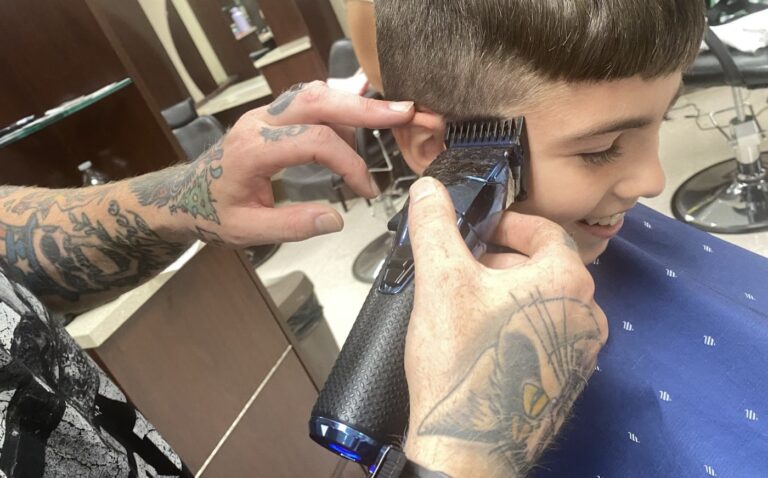 united-way-s-back-to-school-energizer-provides-free-haircuts