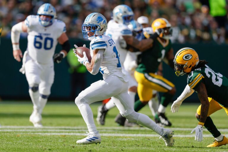 Detroit Lions wide receiver Amon-Ra St. Brown (14) catches a pass during an NFL football game between the Detroit Lions and Green Bay Packers Sunday, Sept. 7, 2025, in Green Bay, Wis. (AP Photo/Matt Ludtke)
