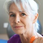 Portrait,Of,Senior,Woman,Lifting,Dumbbells