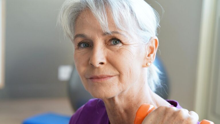 Portrait,Of,Senior,Woman,Lifting,Dumbbells