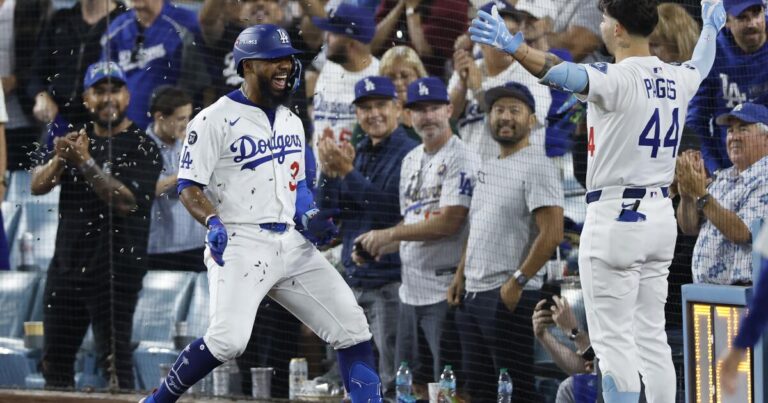 dodgers-surge-with-10-5-victory-over-reds-in-playoff-opener