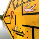 late-artist-eliot-brown-s-alligator-signs-blend-humor-and-awareness