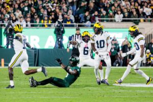 michigan-triumphs-over-michigan-state-31-20-in-rivalry-clash