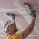 The,Worker,Make,A,Plasterboard,Ceiling.,He,Does,Taping,Plaster